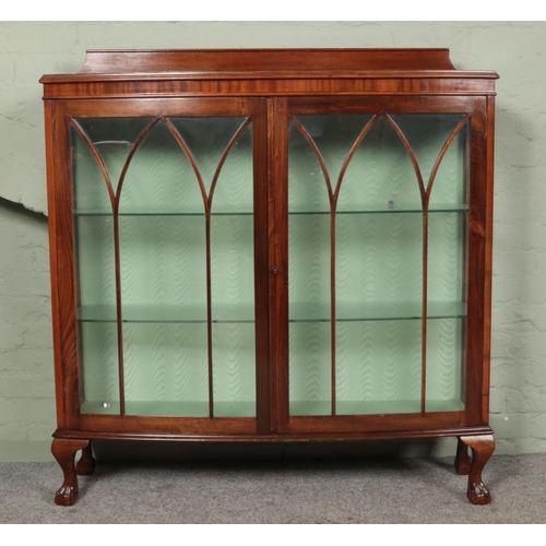 456 - A mahogany display cabinet raised on ball and claw feet.