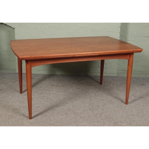 460 - A Danish Gudme Mobelfabrik teak drawer leaf dining table raised on tapering supports. Stamped Gudme ... 