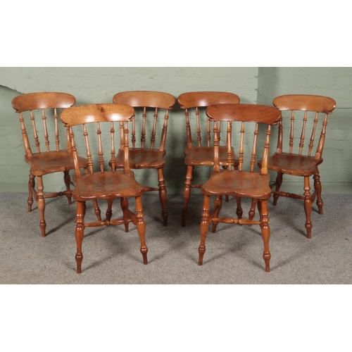 462 - A set of six ash and elm spindle back kitchen chairs.