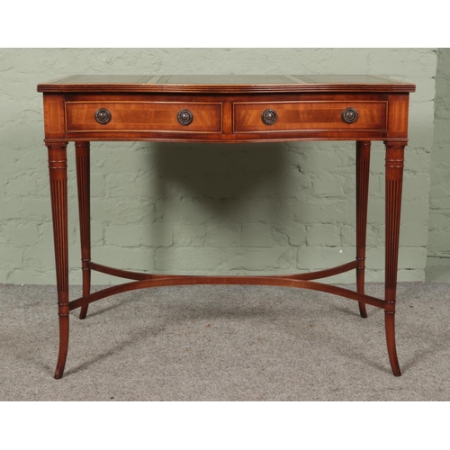 473 - Hunter and Smallpage of York mahogany, leather inset console table featuring serpentine front and tw... 