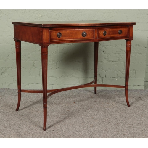 473 - Hunter and Smallpage of York mahogany, leather inset console table featuring serpentine front and tw... 