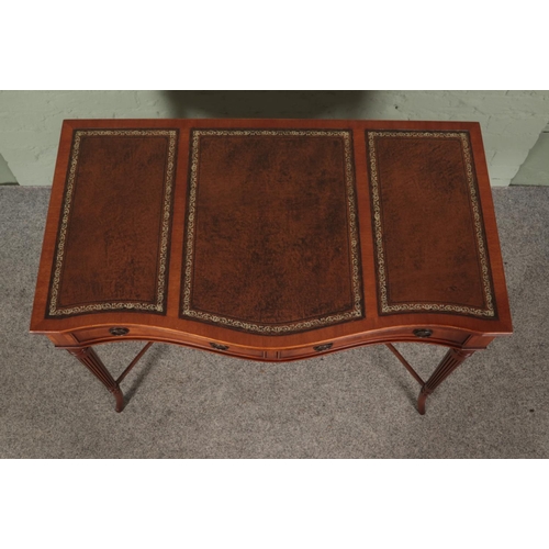 473 - Hunter and Smallpage of York mahogany, leather inset console table featuring serpentine front and tw... 