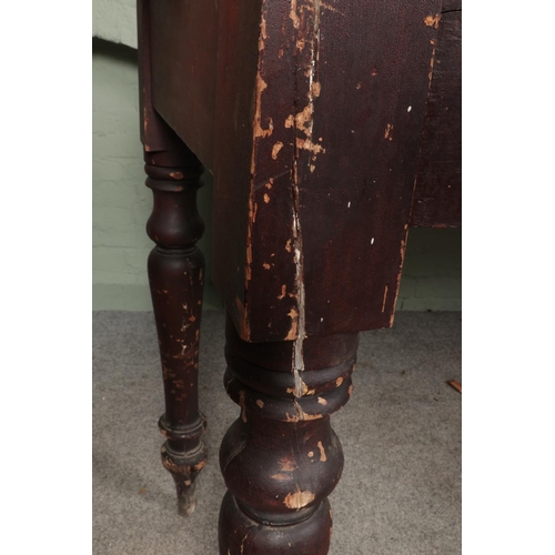 487 - A large Victorian stool height railway station clerks desk with turned legs and cup handle drawers.
... 