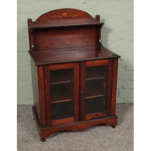 494 - A mahogany glazed smokers cabinet featuring castors to base and inlay to upper shelf. Approx. dimens... 