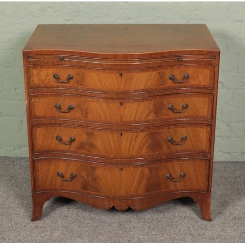 499 - A serpentine chest of four drawers with brushing slide. Approx. dimensions 77cm x 50cm x 78cm.