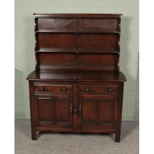 502 - An Ercol dresser with dark stain finish