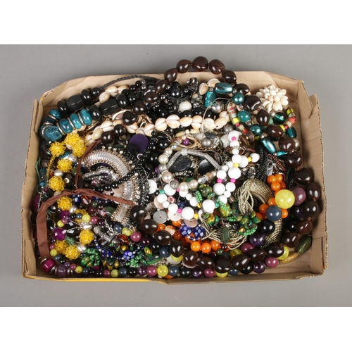 114 - A box containing a good collection of beaded costume jewellery necklaces.