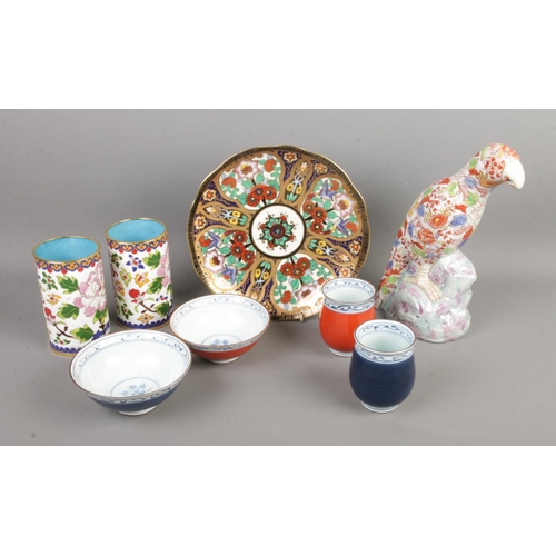 117 - A collection of oriental ceramics to include Imari parrot, enamel and cloisonne brush pots, Noritake... 