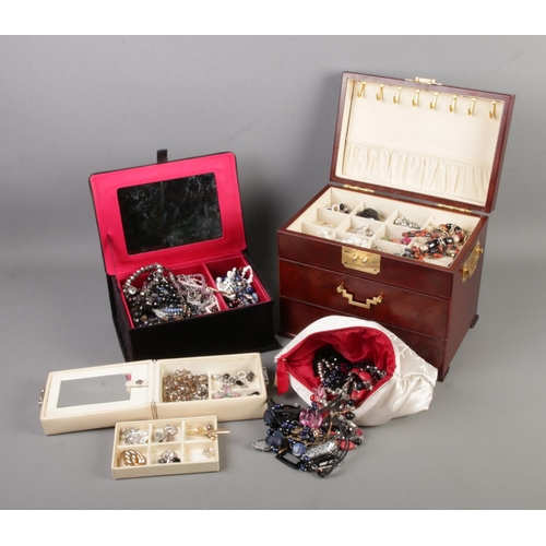 21 - Three jewellery boxes of assorted costume jewellery to include mother of pearl pendants, beaded neck... 