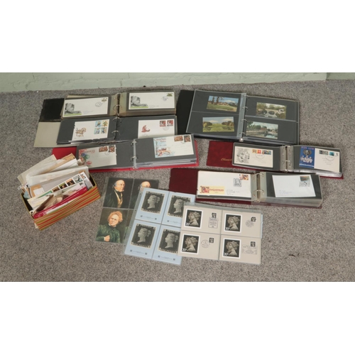 151 - A box of assorted world stamps, first day covers and postcards to include Irish, British and Indian ... 