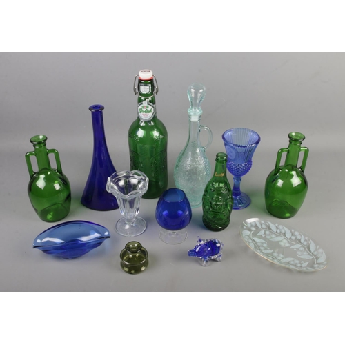 154 - A collection of mostly coloured glass items including large Grolsch lager bottle, Callestock Cider F... 