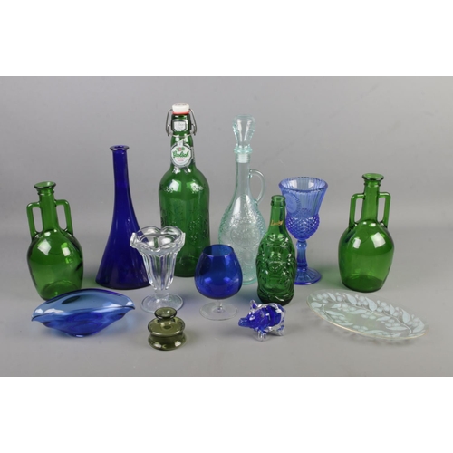 154 - A collection of mostly coloured glass items including large Grolsch lager bottle, Callestock Cider F... 