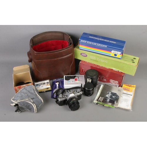 167 - A collection of assorted camera equipment to include Canon AE-1 35mm film camera, Hoya 52mm Skylight... 