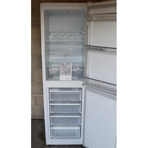 268 - A Grundig upright fridge freezer.