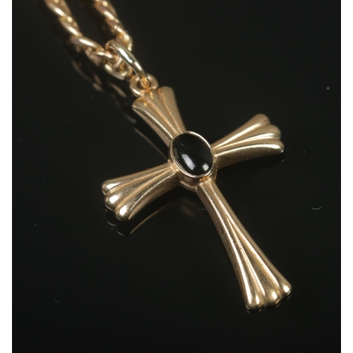 312 - A 9ct gold crucifix pendant on chain featuring central inset stone. Total weight 11.17g.