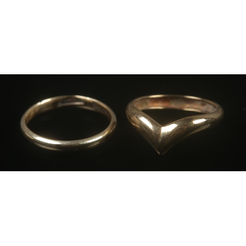 315 - Two 9ct gold rings to include wedding band and wishbone examples. Both rings size K½, total weight 2... 