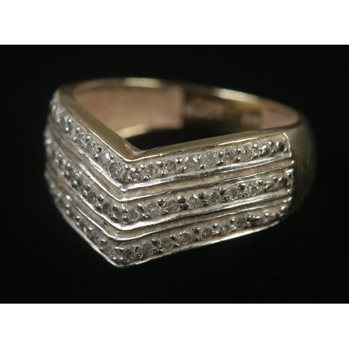 319 - A 9ct gold three row diamond wishbone ring. Size M, 2.94g.