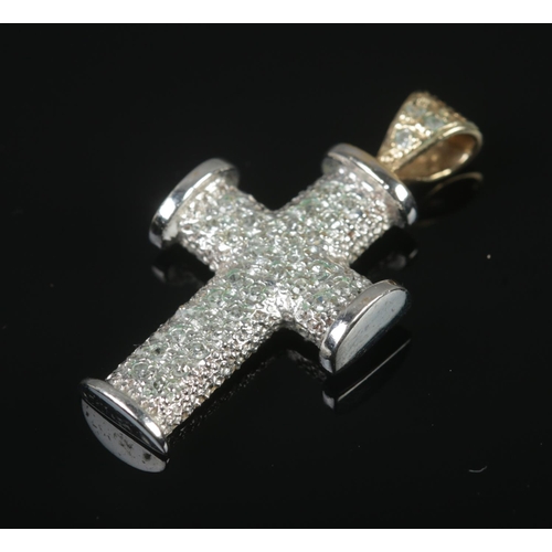 322 - A 9ct white gold and diamond set crucifix pendant. Total weight 3.29g.