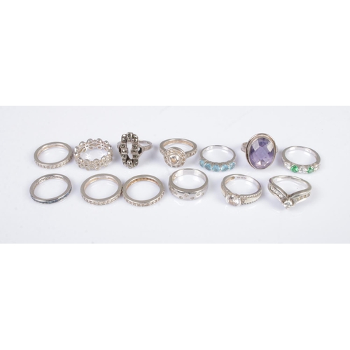 336 - Thirteen silver rings to include eternity and paste set examples. Total weight 43.3g.