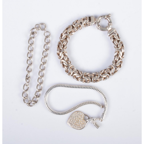 339 - Three silver bracelets to include heart shaped charm. Total weight 57.25g.
