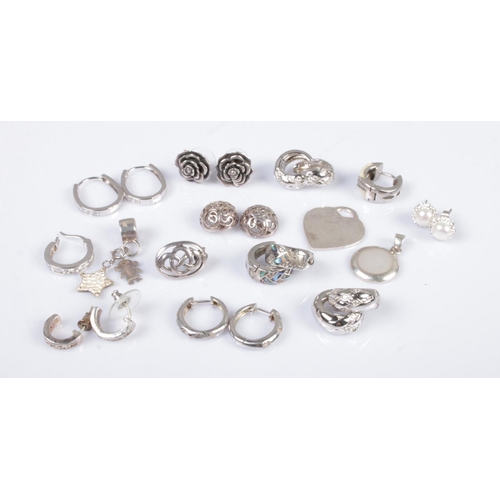 341 - A collection of silver earrings, charms and pendants to include mother of pearl, rose and heart shap... 