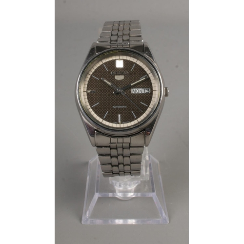 343 - A Seiko 5 automatic water resistant men's watch with black face and luminescent hands. Day and date ... 