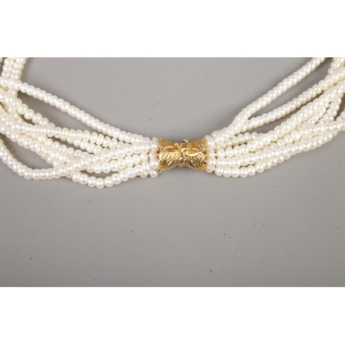 346 - A multi-string cultured pearl necklace featuring 14ct gold clasp.