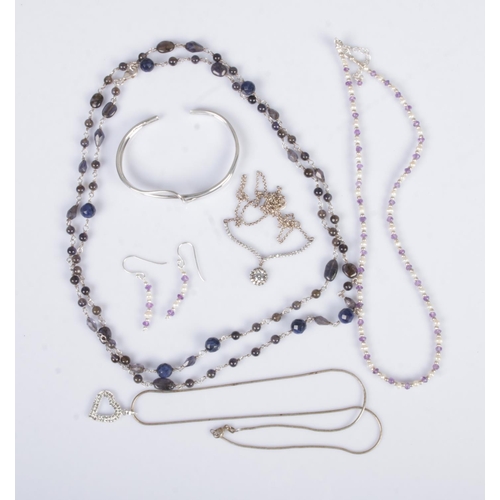 388 - A collection of silver jewellery to include silver bangle, necklaces and one pair of earrings.