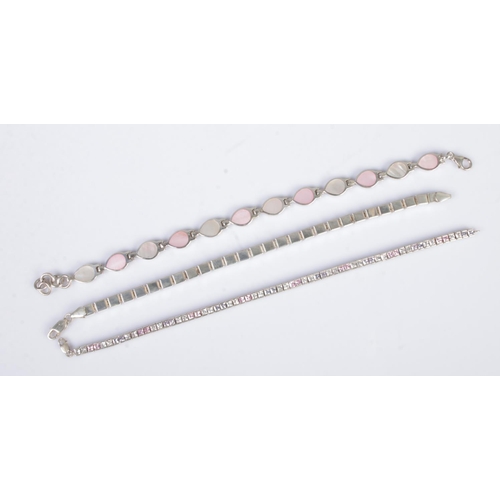 390 - Three silver bracelets to include mother of pearl set example. Total weight 34.09g.