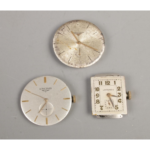 394 - Three Longines watch movements.