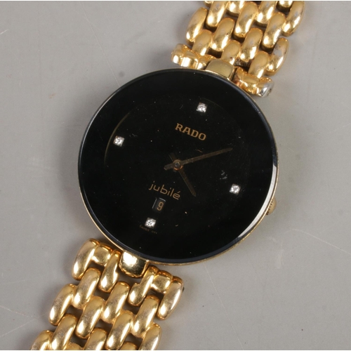 395 - A ladies Rado Jubilé wristwatch featuring diamond set dial and yellow metal strap.