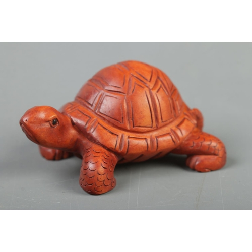 400 - A Japanese carved Netsuke in the form of a tortoise