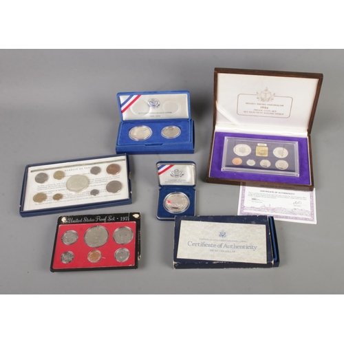 412 - Five cased coins set to include Negara Brunei Darussalam 1986, Monnaie De Paris 1975, US Constitutio... 