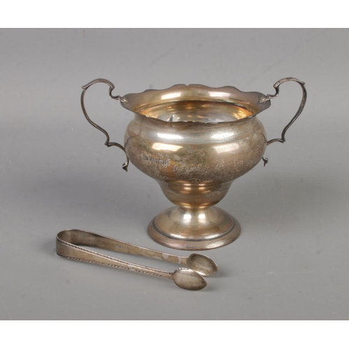 417 - A small Sheffield silver twin handled trophy cup  hallmarked for Mark and Willis (Date indistinct, 1... 