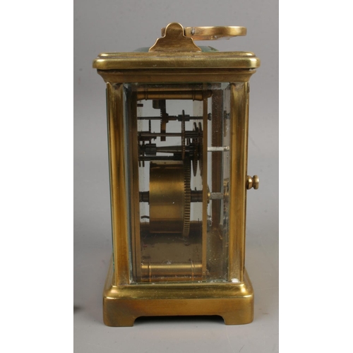 420 - A French carriage clock with open top escapement and Roman numeral markers.