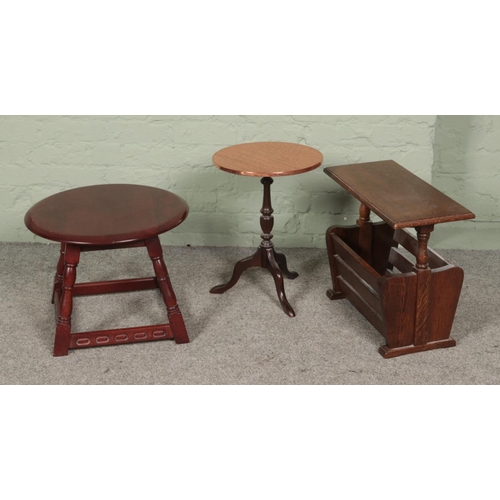 454 - A collection of occasional furniture to include copper topped table and magazine rack.