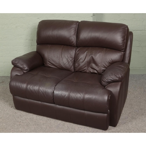 455 - Two brown leather two seater sofas along with a complete leather sofa care kit.