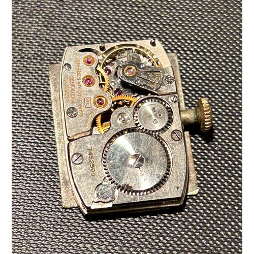 394 - Three Longines watch movements.