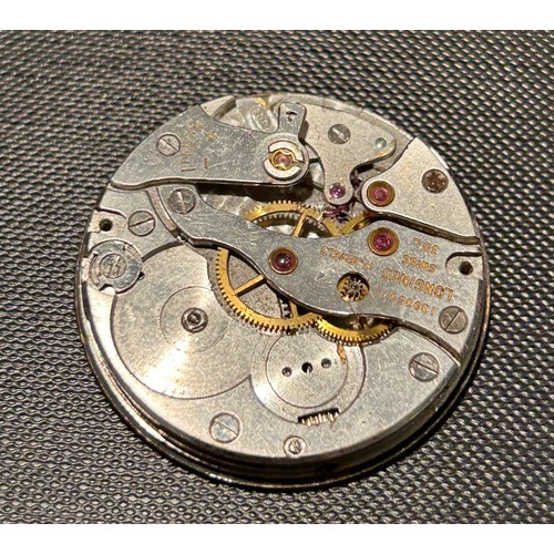 394 - Three Longines watch movements.