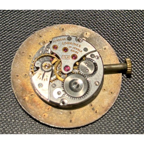 394 - Three Longines watch movements.
