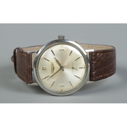 87 - A gents stainless steel Longines manual wristwatch. Having silvered dial, baton and Arabic numeral m... 