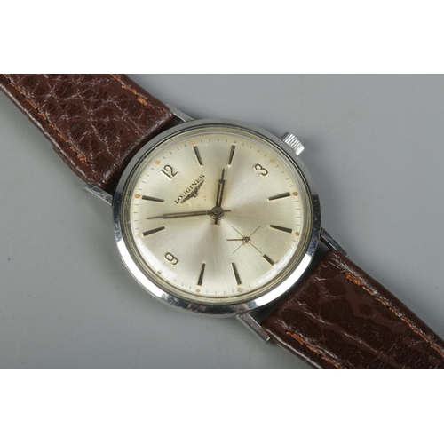 87 - A gents stainless steel Longines manual wristwatch. Having silvered dial, baton and Arabic numeral m... 