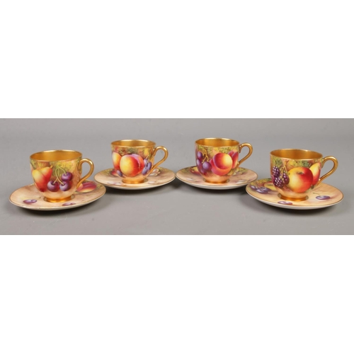 10 - Four Royal Worcester porcelain coffee cups and saucers with hand painted decoration depicting fruit.... 