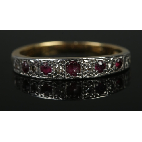 100 - An 18ct gold, diamond and ruby half eternity ring. Size R. 4.36g.