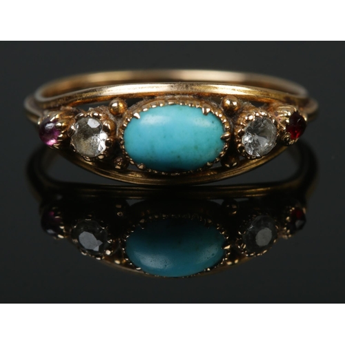 104 - An antique gold turquoise, ruby and clear stone ring. Tested. Size N. 2.12g.