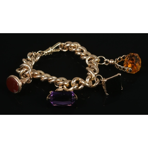 107 - A 9ct gold curb link bracelet with four 9ct gold fobs set with Carnelian, Onyx, Citrine and Amethyst... 