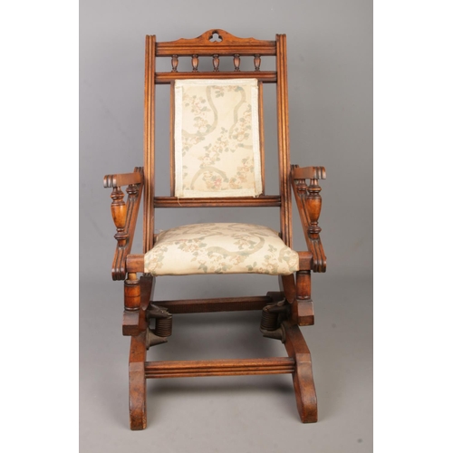 136 - A Victorian mahogany child's rocking chair.