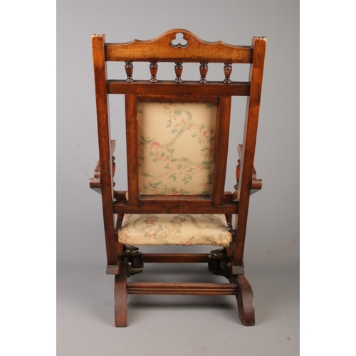 136 - A Victorian mahogany child's rocking chair.