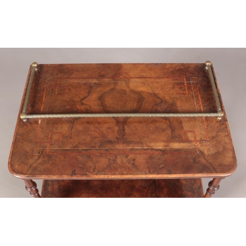 138 - A Victorian walnut two tier side table. Having banded inlaid decoration, gallery top and single draw... 