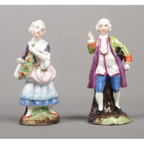 14 - A pair of 19th century continental porcelain figures, lady and a gentleman. Both having impressed ma... 